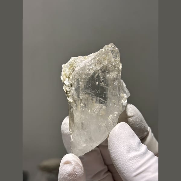 Chunky clear quartz crystal with mica from Xuebaoding, Sichuan — alternate view