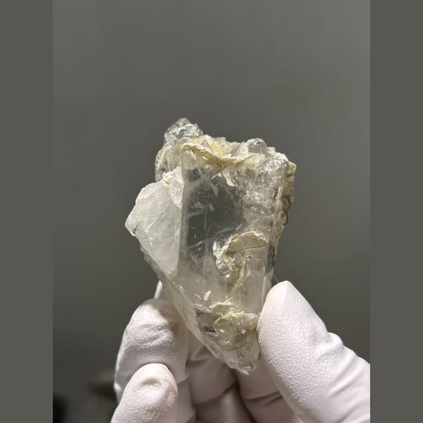 Chunky clear quartz crystal with mica from Xuebaoding, Sichuan — alternate view