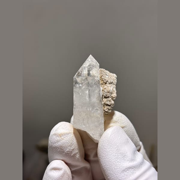 Clear quartz floater with mica from Xuebaoding, Sichuan — detail view