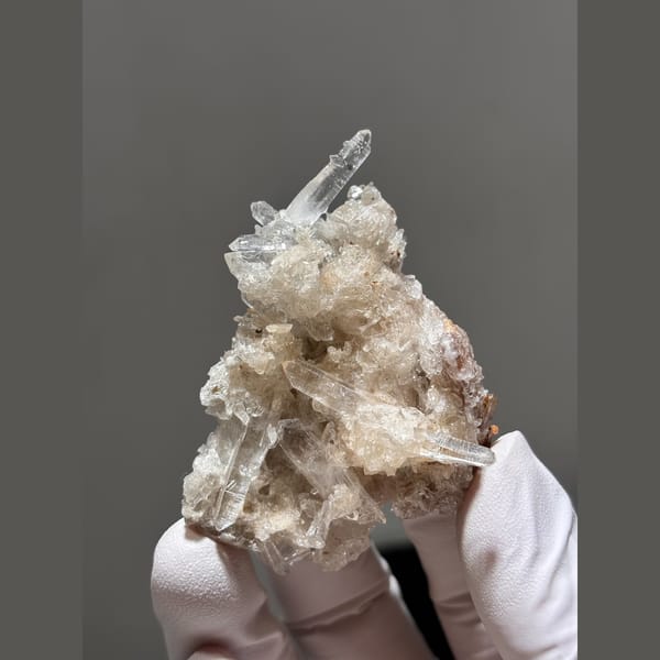 Clear quartz points with cream gypsum from Jinkouhe, Sichuan — complete view