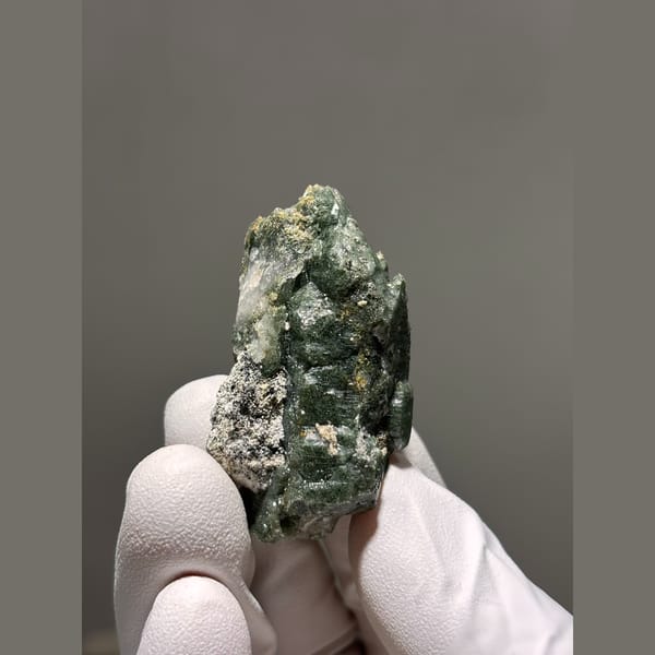 Castle-form quartz with green chlorite phantoms from Tibet — detail view