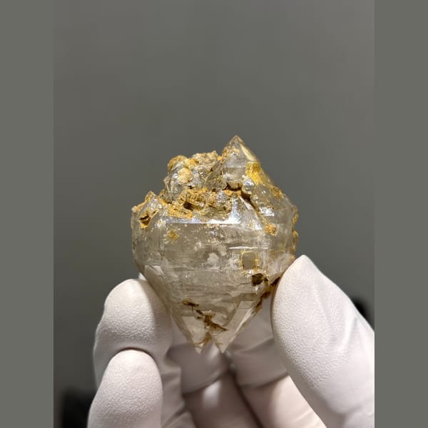 Complete etched double-terminated quartz from Yunnan — detail view