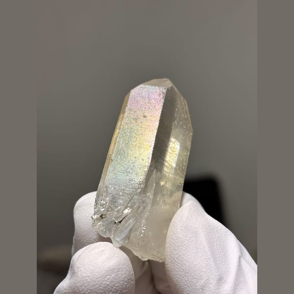 Slim clear to pale yellow quartz point from Xuebaoding, Sichuan — alternate view