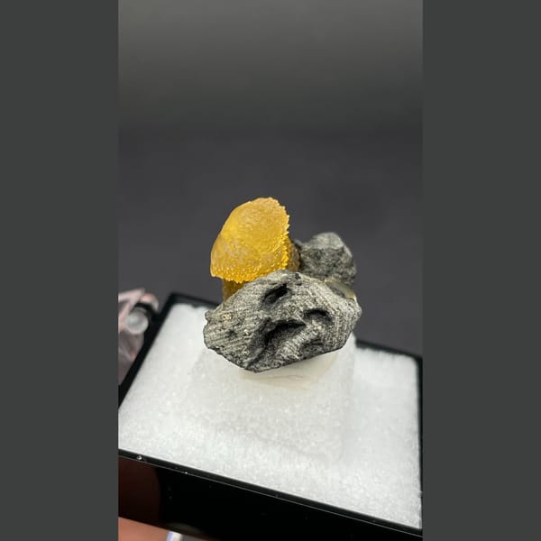 Small amber-brown calcite crystal from Vietnam — alternate view