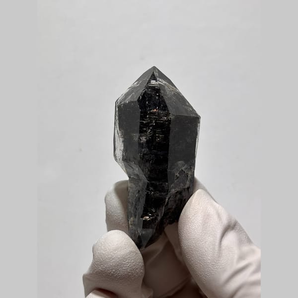 Glossy near-black double-terminated quartz from Yunnan — detail view
