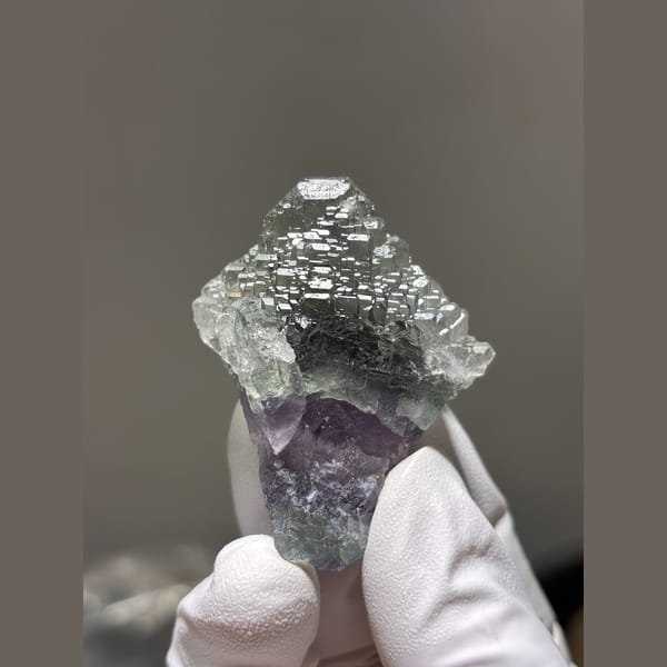 Stepped pale green fluorite with purple base from Fujian — complete view