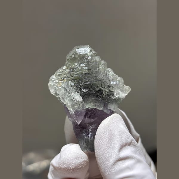Stepped pale green fluorite with purple base from Fujian — alternate view