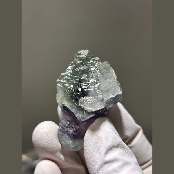 Stepped pale green fluorite with purple base from Fujian — detail view