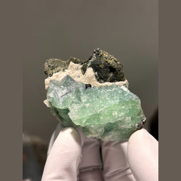 Bright green fluorite on matrix from Hunan — complete view