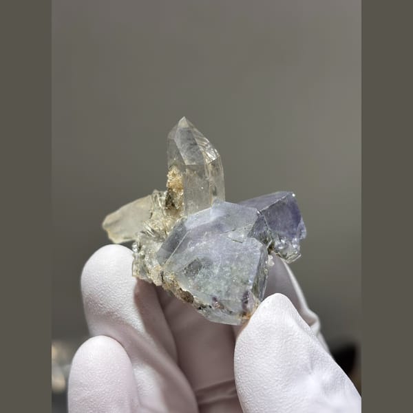 Clear quartz point on blue-grey fluorite from Yaogangxian, Hunan — alternate view