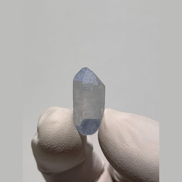 Tiny blue double-terminated dumortierite quartz from Brazil — complete view