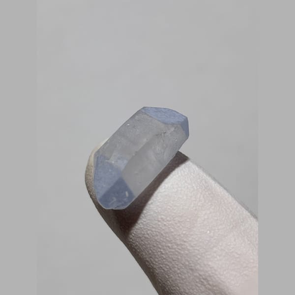 Tiny blue double-terminated dumortierite quartz from Brazil — alternate view