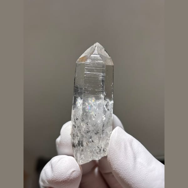 Clear quartz point with internal veils from Jinkouhe, Sichuan — complete view