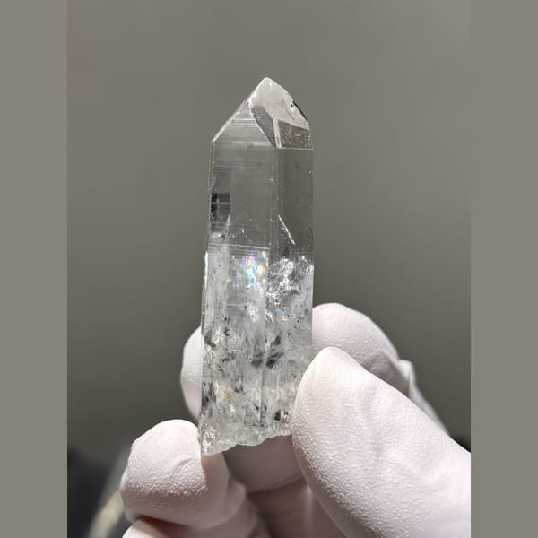 Clear quartz point with internal veils from Jinkouhe, Sichuan — detail view