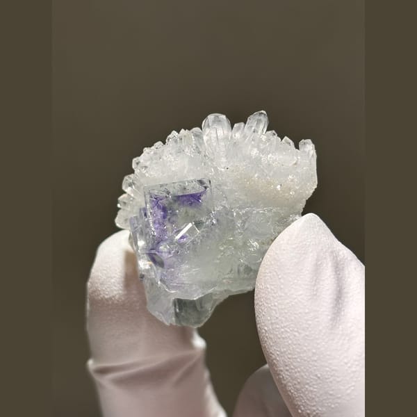 Purple fluorite nestled in sparkling white quartz from Zhejiang — complete view