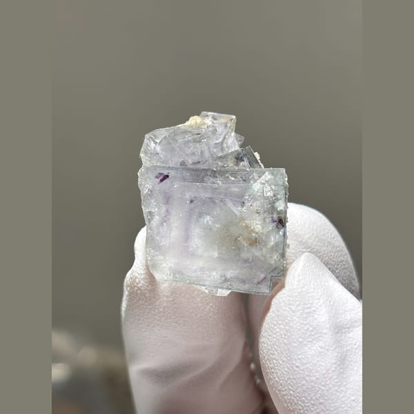 Glassy pale lavender fluorite cube from Yaogangxian — alternate view