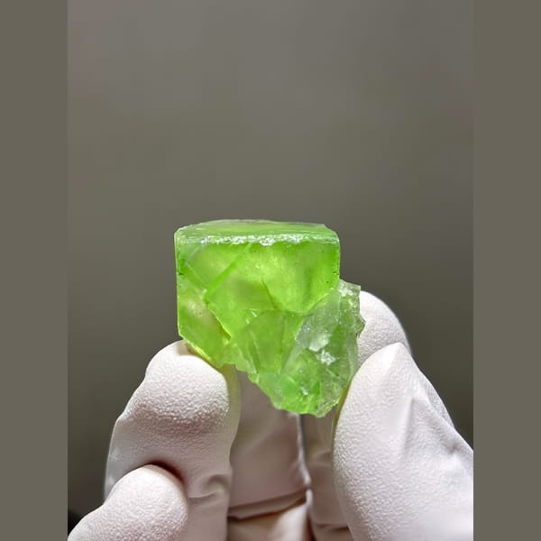 Bright lime green fluorite crystal from Fujian — complete view