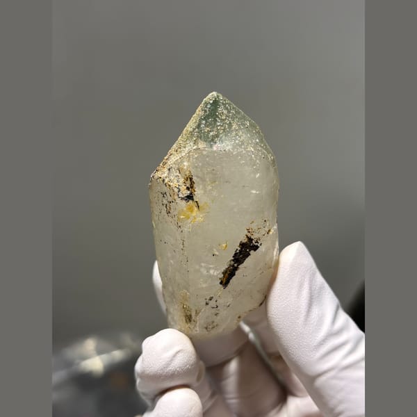 Chunky quartz point with green and rusty inclusions from Tibet — alternate view