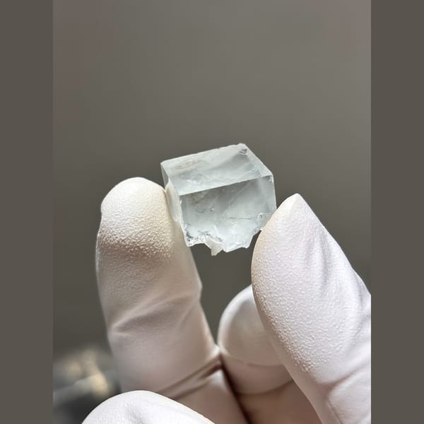 Small glassy pale fluorite cube from Zhejiang — alternate view