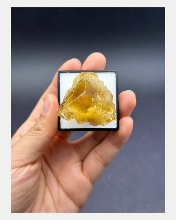 Complete underside and reverse view of yellow fluorite crystal