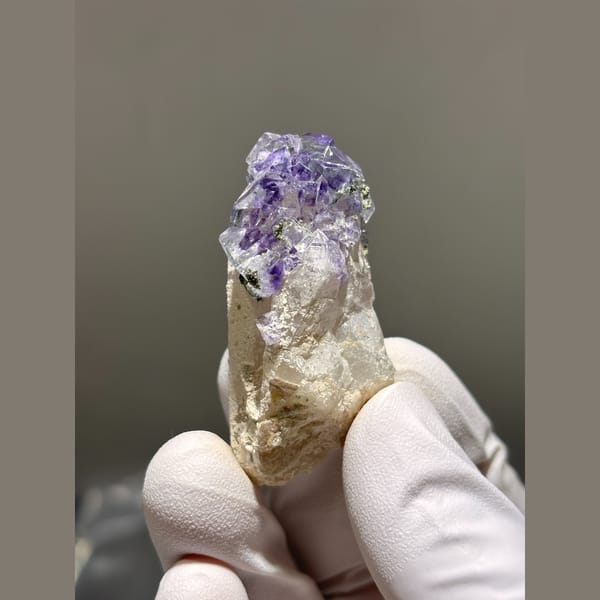 Quartz crystal crowned with purple fluorite from Yaogangxian — alternate view