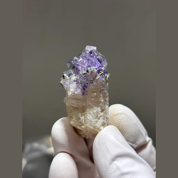 Quartz crystal crowned with purple fluorite from Yaogangxian — alternate view