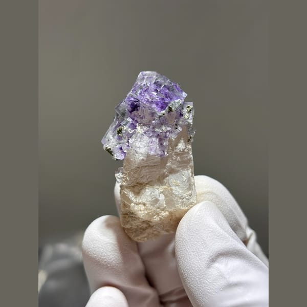 Quartz crystal crowned with purple fluorite from Yaogangxian — detail view