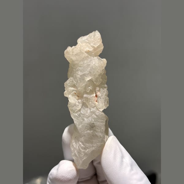 Deeply etched icy quartz crystal from Madagascar — complete view