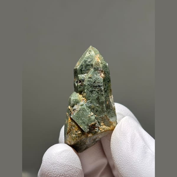Quartz crystal coated in green chlorite from Tibet — complete view