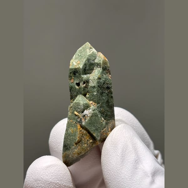 Quartz crystal coated in green chlorite from Tibet — alternate view