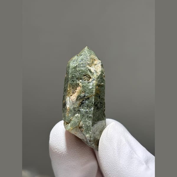 Quartz crystal coated in green chlorite from Tibet — alternate view