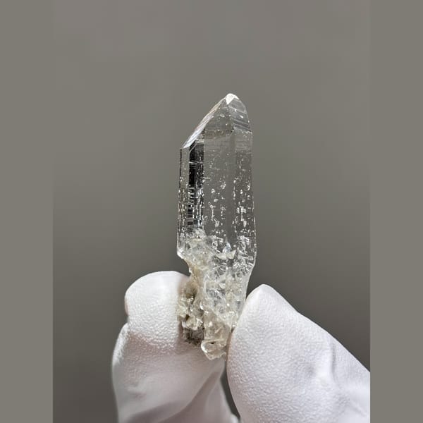 Water-clear quartz point from Xuebaoding, Sichuan — alternate view