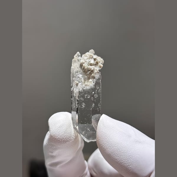 Water-clear quartz point from Xuebaoding, Sichuan — alternate view