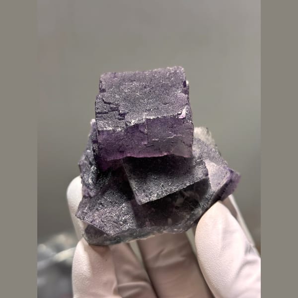 Interlocking dark purple fluorite cubes from Inner Mongolia — complete view