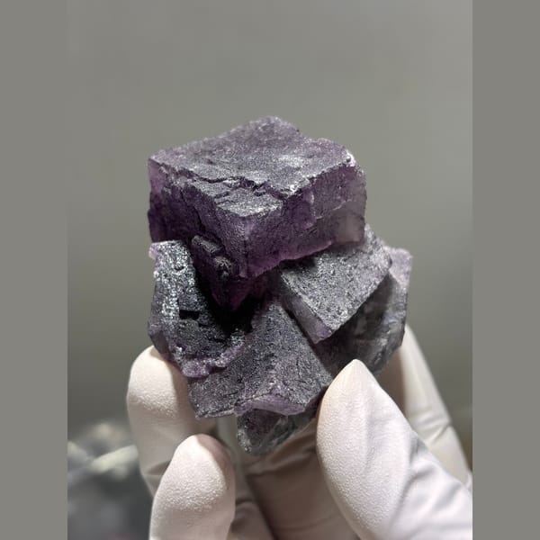 Interlocking dark purple fluorite cubes from Inner Mongolia — alternate view