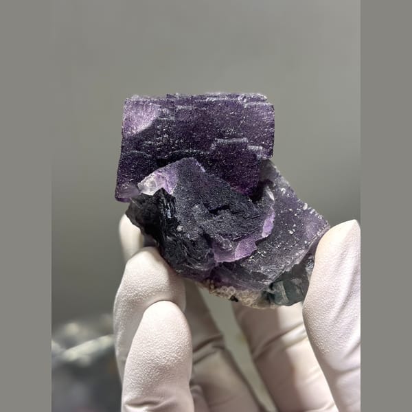 Interlocking dark purple fluorite cubes from Inner Mongolia — alternate view