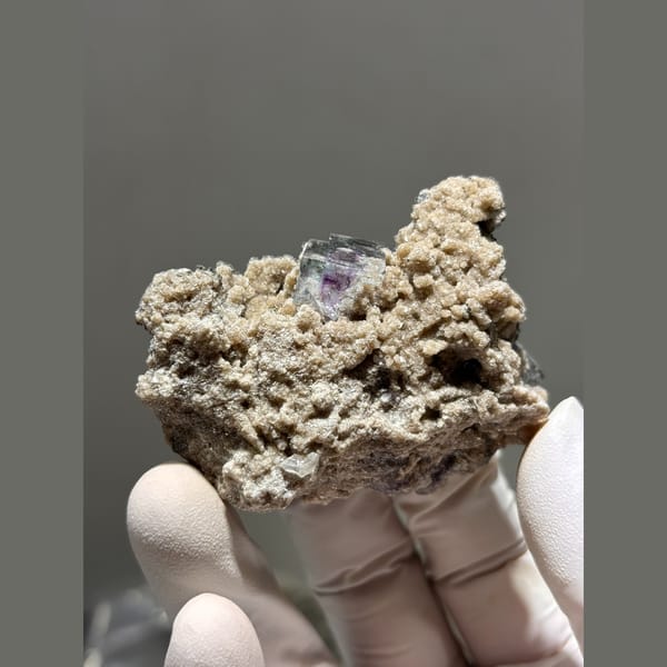 Purple fluorite with mica and quartz in matrix from Yaogangxian — complete view