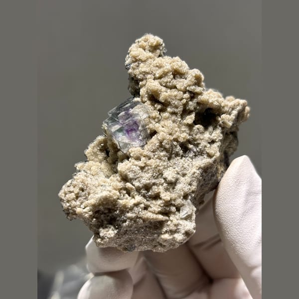 Purple fluorite with mica and quartz in matrix from Yaogangxian — alternate view