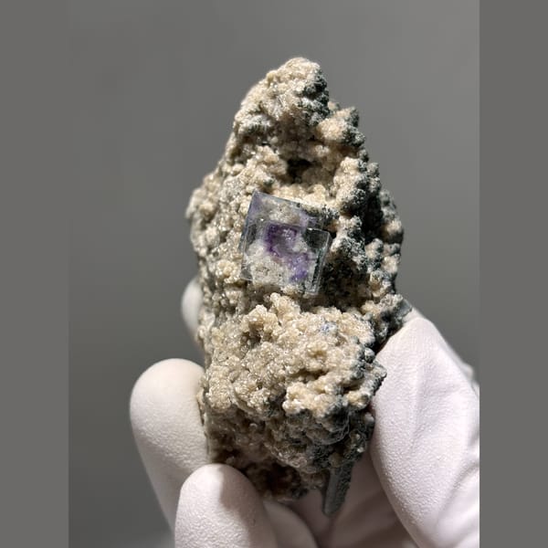 Purple fluorite with mica and quartz in matrix from Yaogangxian — alternate view
