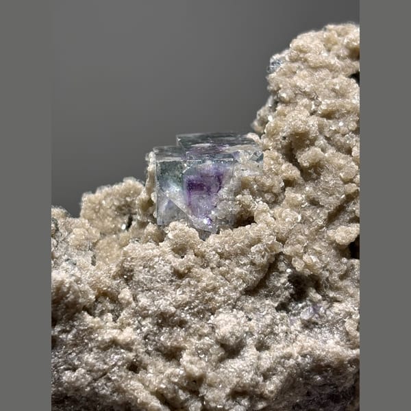 Purple fluorite with mica and quartz in matrix from Yaogangxian — detail view