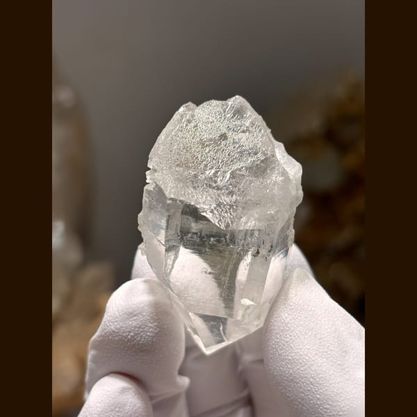 Clear etched quartz floater from Xuebaoding — detail view