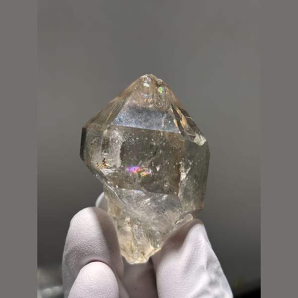 Champagne quartz crystal with internal rainbows from Yunnan — detail view