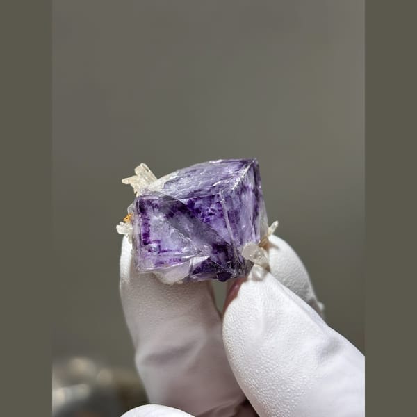 Purple fluorite cube with small quartz crystals from Yaogangxian — alternate view