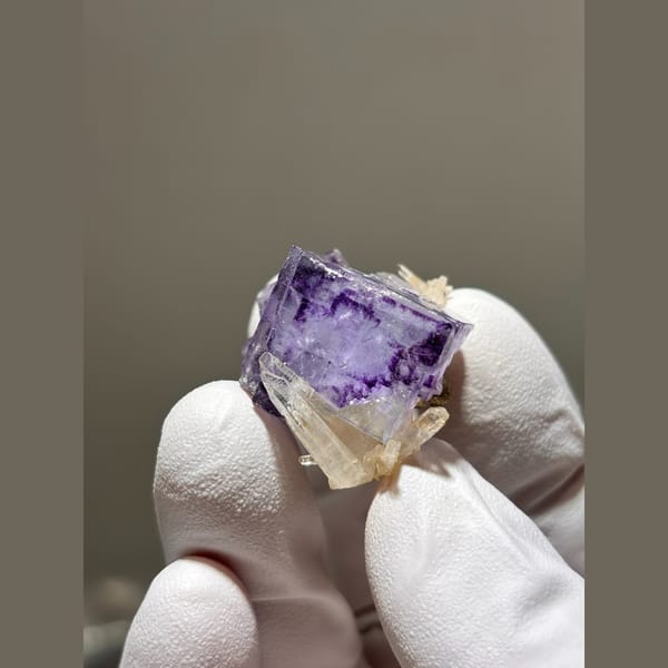 Purple fluorite cube with small quartz crystals from Yaogangxian — detail view