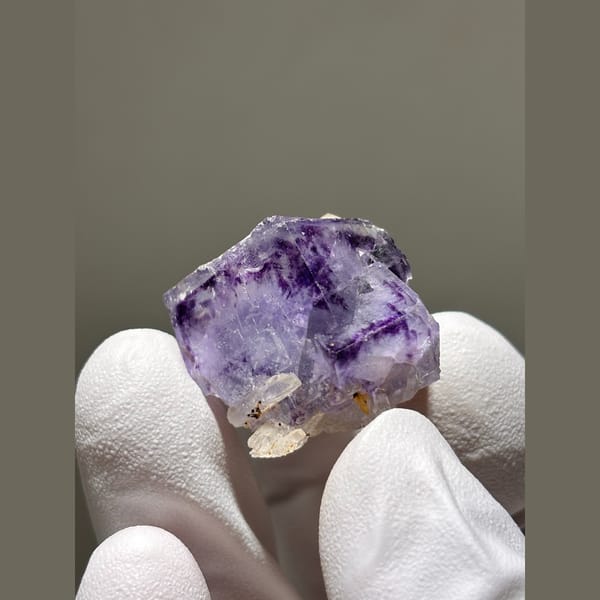 Purple fluorite cube with small quartz crystals from Yaogangxian — detail view