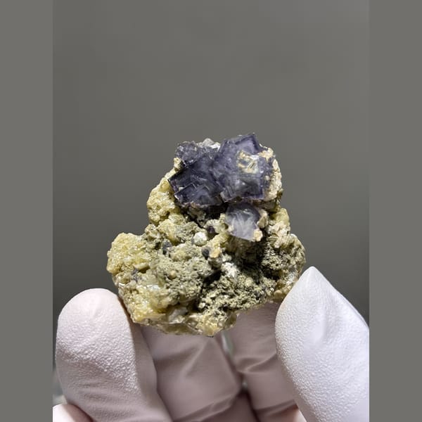 Purple fluorite cubes on mica matrix from Yaogangxian — complete view