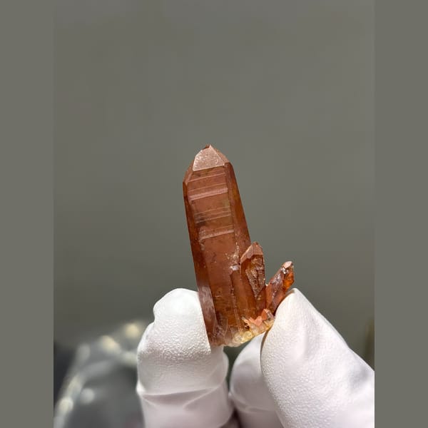 Red hematite coated quartz point from Brazil — alternate view