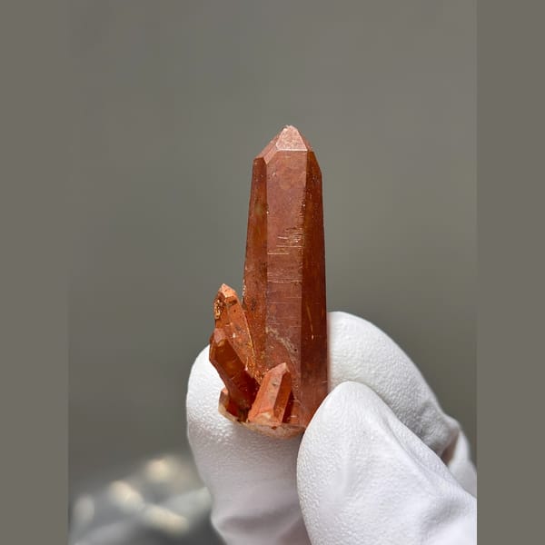 Red hematite coated quartz point from Brazil — alternate view