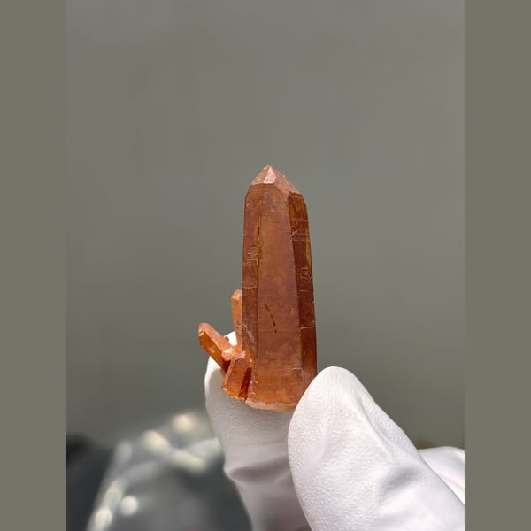 Red hematite coated quartz point from Brazil — detail view