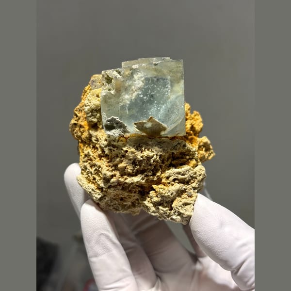 Pale green fluorite cubes on orange matrix from Yaogangxian — alternate view